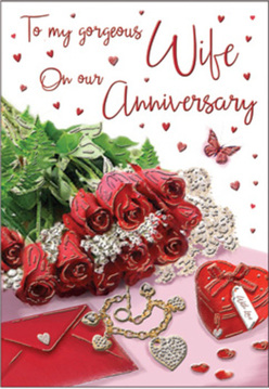 This image captures the feeling of a private anniversary celebration, set out as a tender still life under soft daylight. A small, opulent bouquet of crimson red roses forms the centrepiece, their petals swirling in tight, elegant spirals that almost seem to move. The blooms are framed with fresh greenery, the leaves crisp and lively, giving the impression of roses just delivered to a doorstep off Squirrels Heath Road in Harold Wood. Close to the bouquet lies an envelope, slightly propped, with a smooth, creamy surface that suggests a heartfelt message within, perhaps written late at night at a familiar kitchen table. A refined piece of jewellery, maybe a slender chain or pendant, rests nearby, its subtle shine hinting at a special gift carefully chosen for this milestone. A deep red, heart-shaped keepsake box completes the trio of treasures, its surface smooth and inviting, as if holding memories from many anniversaries past. Strewn across the scene are small heart shapes and tiny sparkling elements that catch and reflect the light, echoing the flicker of candles on an anniversary dinner table. A single butterfly motif drifts through the design, evoking the gentle flutter of emotion when looking back on shared years. The script on the card flows with an easy grace, curving among the decorative hearts without overpowering the floral focal point. Shadows are soft, highlights gentle, creating a sense of quiet intimacy rather than drama. Styled with a florist's precision, the composition feels like a thoughtful moment frozen in time, ready to accompany anniversary flower delivery across Harold Wood for couples celebrating love that has only grown stronger.